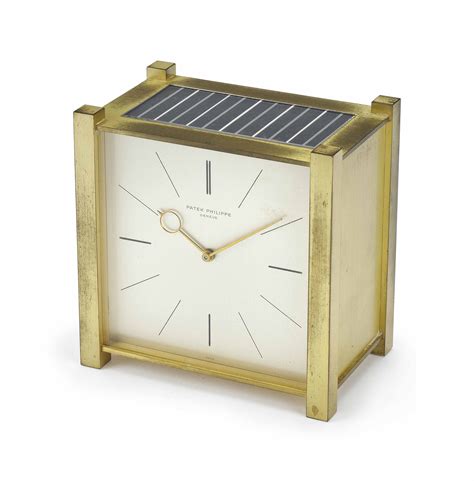 Patek Philippe. A gilt brass square